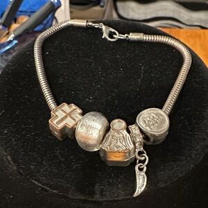 Silver Faith based Charm Bracelet with Unique Beads. Cross, “Faith”, Madonna.